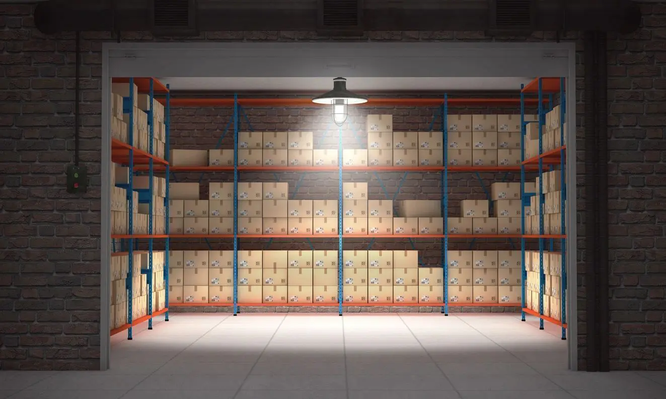 A warehouse with many shelves filled with boxes.